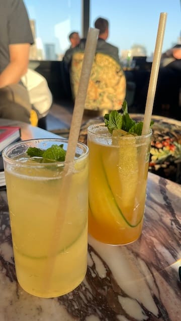 Photo of two cocktails on a table.