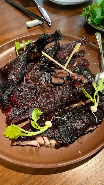 Photo of a plate with peking duck.