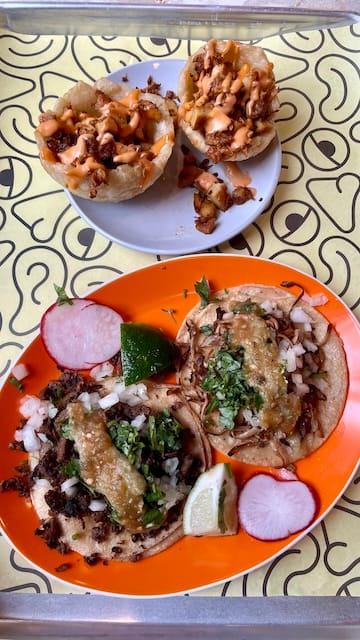 Picture of a plate of tacos and a plate of mofongo cups