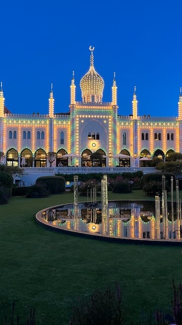 Photo of a castle in the even with lights