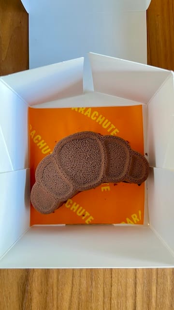 Picture of a chocolate pastry in the shape of a croissant