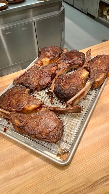 Picture of a sheet rack of several large steaks