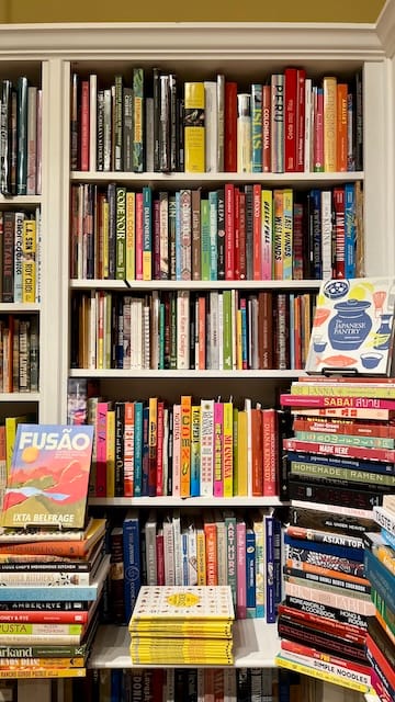 Picture of a bookcase stacked with books of all shapes and colors