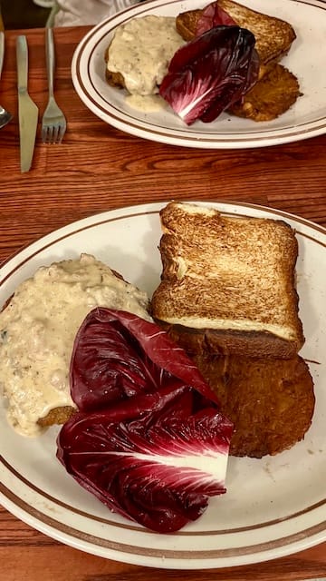 picture of chicken fried steak, toast, and endives on a plate