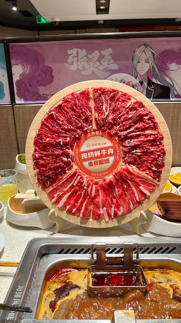 A picture of a meal wheel in front of a hot pot table