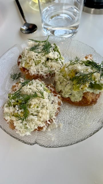 picture of 3 avocado toasts on a clear plate